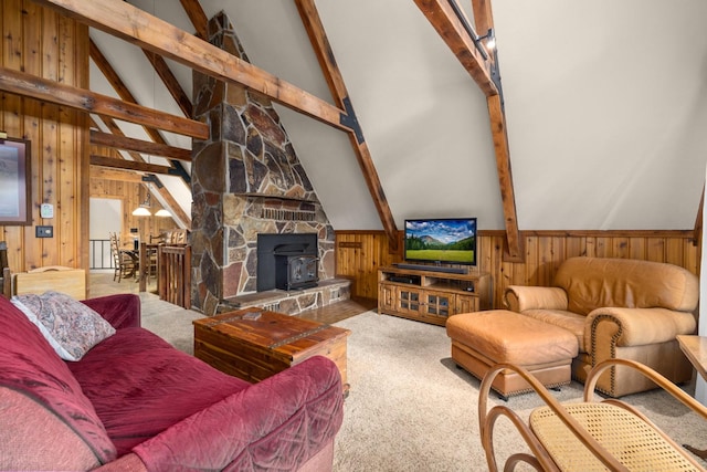 250 Sunday Ln, Kalispell, MT 59901 - living room with wooden walls, carpet, and a wood stove