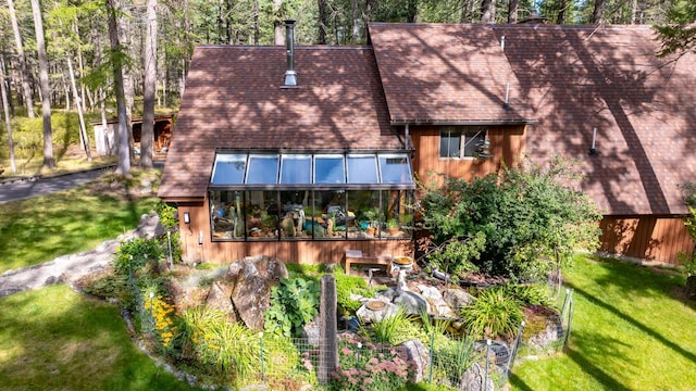 250 Sunday Ln, Kalispell, MT 59901 - rear view of house with a yard and roof with shingles