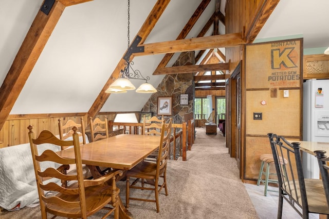 250 Sunday Ln, Kalispell, MT 59901 - dining area with light colored carpet, beamed ceiling, wooden walls, and high vaulted ceiling