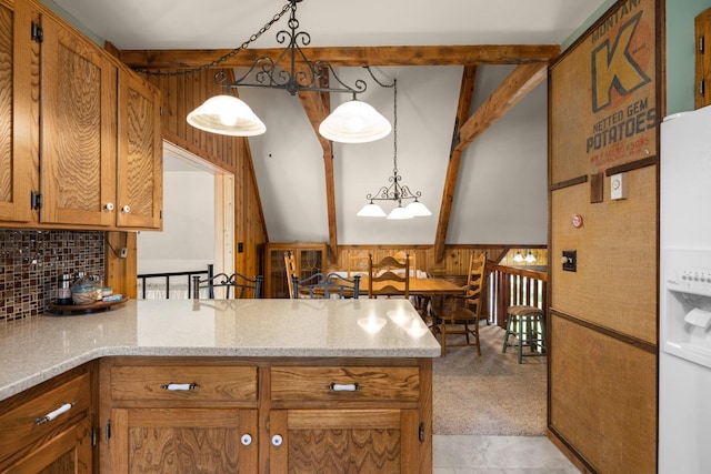 250 Sunday Ln, Kalispell, MT 59901 - kitchen featuring a peninsula, backsplash, brown cabinetry, white fridge with ice dispenser, and pendant lighting