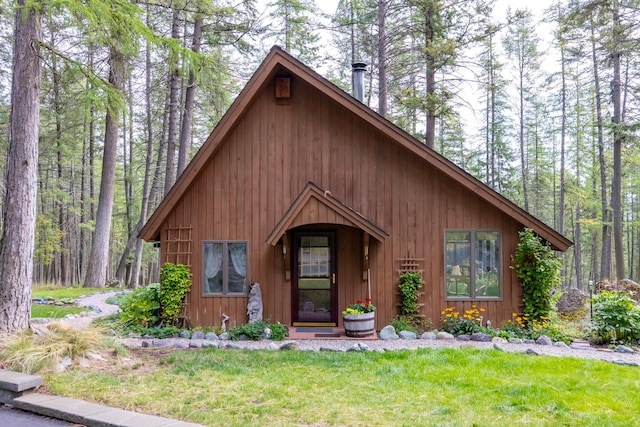 250 Sunday Ln, Kalispell, MT 59901 - rustic home featuring a front yard and a wooded view