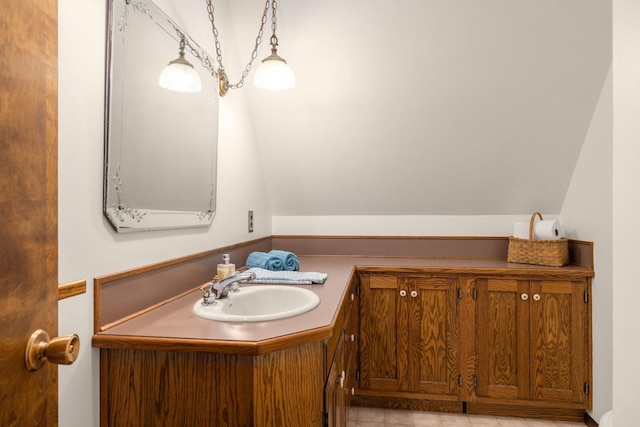 250 Sunday Ln, Kalispell, MT 59901 - bathroom with vanity and lofted ceiling
