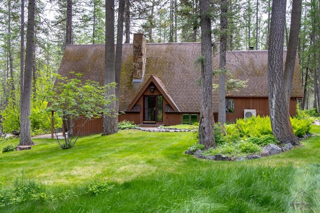 250 Sunday Ln, Kalispell, MT 59901 - a-frame style home with a chimney and a front yard