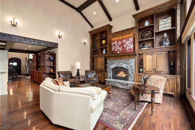 360 Plantation Dr, Kalispell, MT 59901 - living area featuring a stone fireplace, arched walkways, and dark wood-style floors