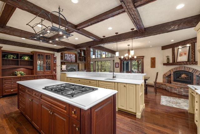 360 Plantation Dr, Kalispell, MT 59901 - kitchen featuring stainless steel gas cooktop, open shelves, a chandelier, light countertops, and a center island