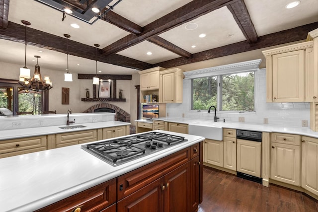 360 Plantation Dr, Kalispell, MT 59901 - kitchen featuring a sink, stainless steel gas cooktop, a chandelier, cream cabinets, and coffered ceiling