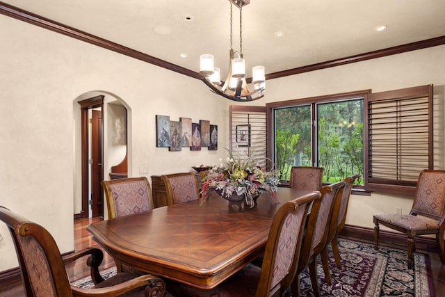 360 Plantation Dr, Kalispell, MT 59901 - dining space with a chandelier, wood finished floors, arched walkways, crown molding, and recessed lighting