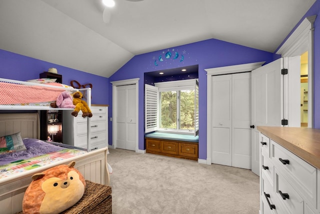360 Plantation Dr, Kalispell, MT 59901 - bedroom featuring multiple closets, lofted ceiling, light colored carpet, ceiling fan, and baseboards