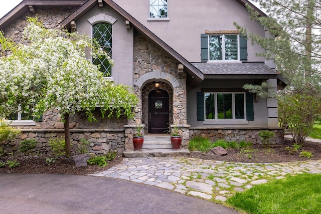 360 Plantation Dr, Kalispell, MT 59901 - view of front facade featuring stone siding and stucco siding