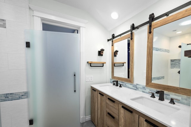 360 Plantation Dr, Kalispell, MT 59901 - bathroom featuring double vanity, tasteful backsplash, and vaulted ceiling