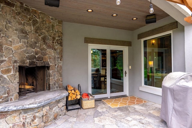 360 Plantation Dr, Kalispell, MT 59901 - view of patio featuring a fireplace and grilling area