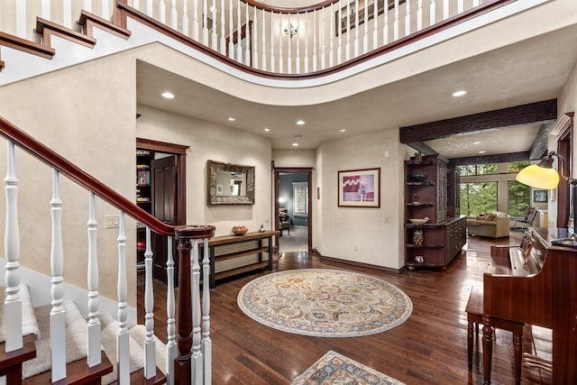 360 Plantation Dr, Kalispell, MT 59901 - entrance foyer featuring wood-type flooring, a high ceiling, baseboards, stairs, and recessed lighting