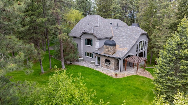 360 Plantation Dr, Kalispell, MT 59901 - view of front of home with stucco siding, a front lawn, stone siding, and a patio area