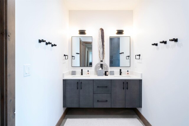 175 N Prairiesmoke Cir, Whitefish, MT 59937 - bathroom featuring double vanity and baseboards