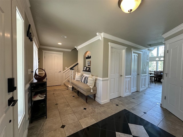 2413 Capstone Ct, Thompson Falls, MT 59873 - entrance foyer featuring recessed lighting, ornamental molding, light tile patterned floors, wainscoting, and a decorative wall