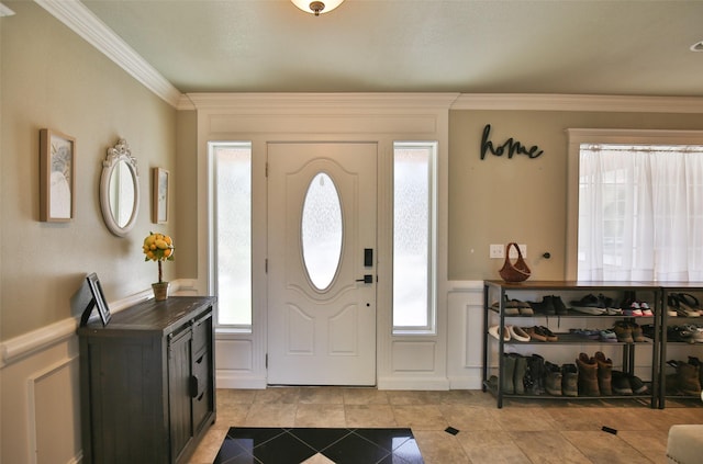 2413 Capstone Ct, Thompson Falls, MT 59873 - entryway with light tile patterned floors, crown molding, a decorative wall, and a wainscoted wall
