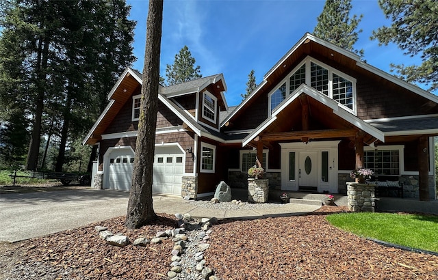 2413 Capstone Ct, Thompson Falls, MT 59873 - craftsman inspired home with stone siding, covered porch, and driveway