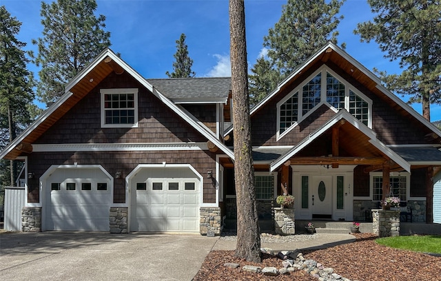2413 Capstone Ct, Thompson Falls, MT 59873 - craftsman inspired home with driveway, a porch, stone siding, and roof with shingles