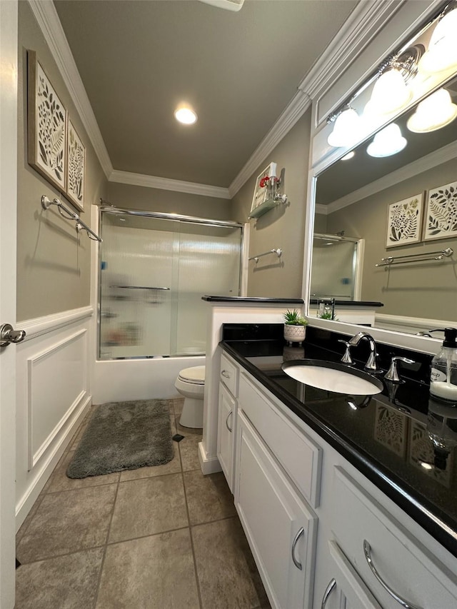 2413 Capstone Ct, Thompson Falls, MT 59873 - bathroom with crown molding, vanity, toilet, bath / shower combo with glass door, and tile patterned floors