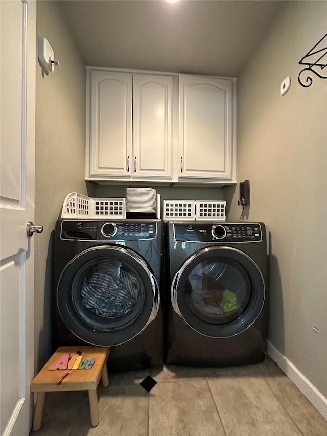 2413 Capstone Ct, Thompson Falls, MT 59873 - laundry area featuring cabinet space, washing machine and clothes dryer, and baseboards