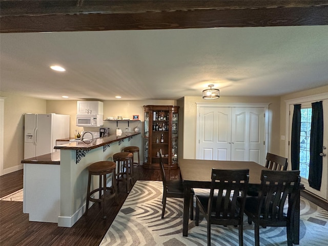 2413 Capstone Ct, Thompson Falls, MT 59873 - dining area featuring baseboards, dark wood-type flooring, and recessed lighting