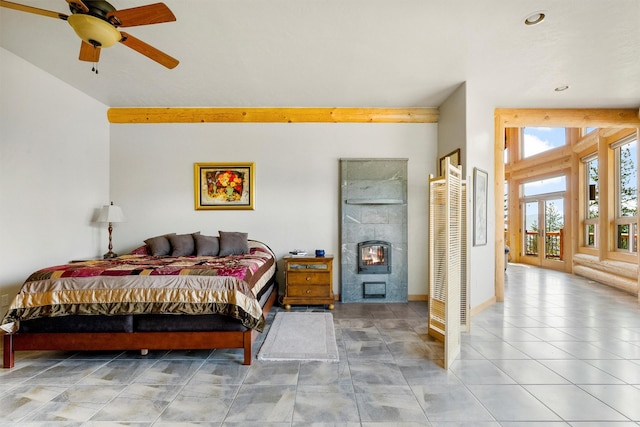 956 Falling Star Rd, Victor, MT 59875 - tiled bedroom featuring access to outside, recessed lighting, a tiled fireplace, and a ceiling fan