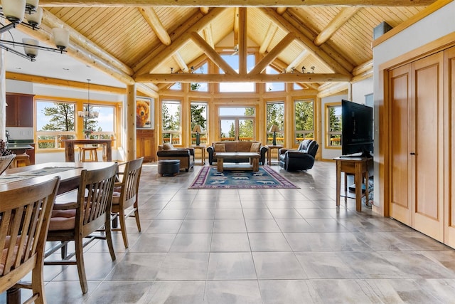 956 Falling Star Rd, Victor, MT 59875 - living area featuring a wood ceiling with exposed beams, high vaulted ceiling, and light tile patterned floors