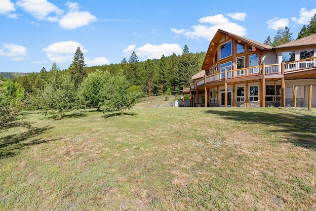 956 Falling Star Rd, Victor, MT 59875 - view of green lawn with a deck