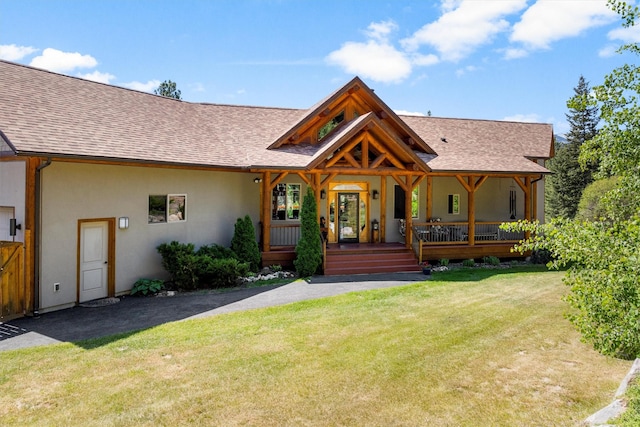 956 Falling Star Rd, Victor, MT 59875 - view of front of property featuring a shingled roof and a front yard