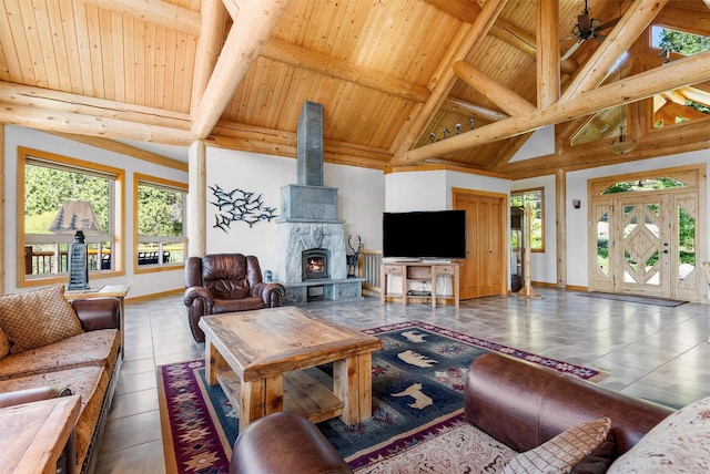 956 Falling Star Rd, Victor, MT 59875 - living area with a wood ceiling with exposed beams, plenty of natural light, high vaulted ceiling, and a ceiling fan