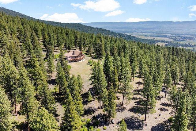 956 Falling Star Rd, Victor, MT 59875 - aerial view of property and surrounding area with a heavily wooded area and mountains