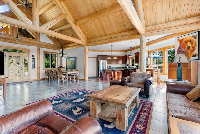 956 Falling Star Rd, Victor, MT 59875 - living area featuring a wood ceiling with exposed beams, a chandelier, light tile patterned floors, and high vaulted ceiling