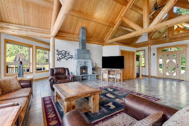 956 Falling Star Rd, Victor, MT 59875 - living room with a wooden ceiling with exposed beams, high vaulted ceiling, and a ceiling fan