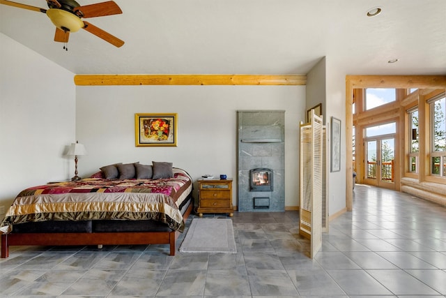 956 Falling Star Rd, Victor, MT 59875 - bedroom featuring recessed lighting, access to exterior, beam ceiling, and a tile fireplace
