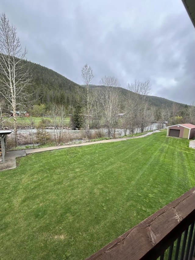 4848 US Highway 89, Monarch, MT 59463 - view of green lawn with a mountain view and an outbuilding