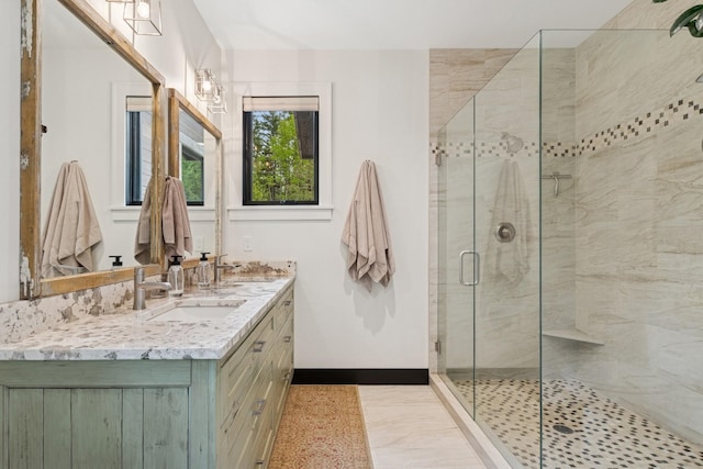 103 Glacier Hills Dr E, Martin City, MT 59926 - bathroom with a stall shower, double vanity, and baseboards
