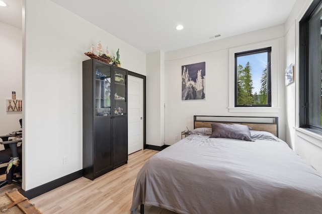 103 Glacier Hills Dr E, Martin City, MT 59926 - bedroom with light wood finished floors, recessed lighting, and baseboards