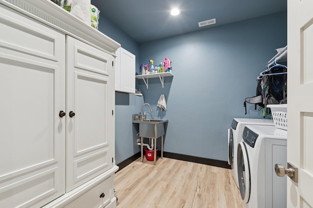 103 Glacier Hills Dr E, Martin City, MT 59926 - laundry area with separate washer and dryer, light wood-type flooring, cabinet space, and recessed lighting