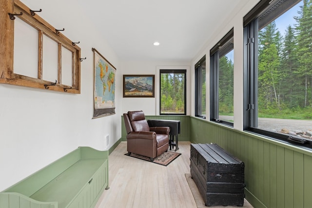 103 Glacier Hills Dr E, Martin City, MT 59926 - sitting room featuring wood finished floors, recessed lighting, wainscoting, and wooden walls