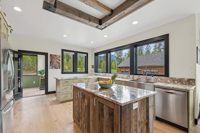 103 Glacier Hills Dr E, Martin City, MT 59926 - kitchen with appliances with stainless steel finishes, a sink, recessed lighting, a kitchen island, and light wood finished floors