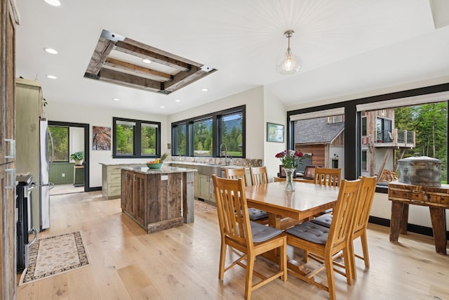 103 Glacier Hills Dr E, Martin City, MT 59926 - dining area featuring a raised ceiling, plenty of natural light, recessed lighting, and light wood finished floors