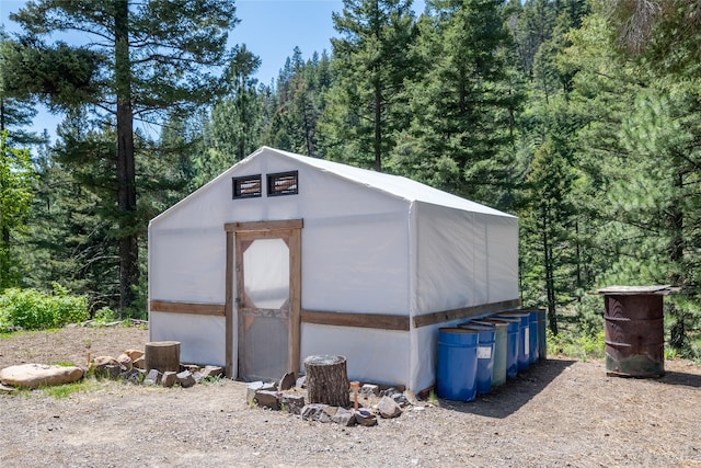 18711 Copper Ridge Trl, Florence, MT 59833 - view of greenhouse with a forest view
