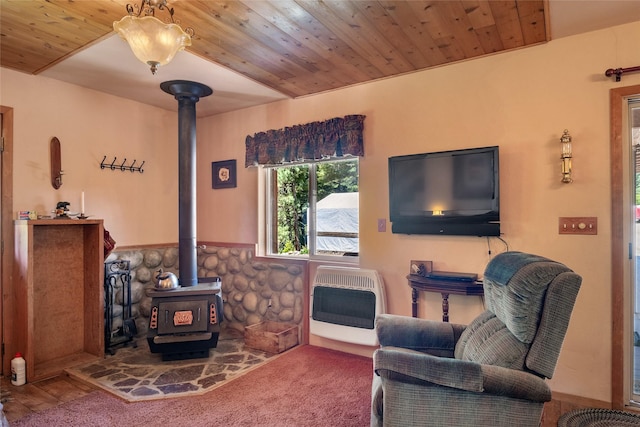 18711 Copper Ridge Trl, Florence, MT 59833 - living area with heating unit, a wood stove, and wood ceiling