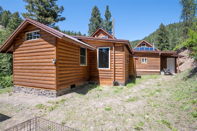 18711 Copper Ridge Trl, Florence, MT 59833 - rear view of property with faux log siding