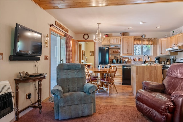 18711 Copper Ridge Trl, Florence, MT 59833 - living area with heating unit, a chandelier, light carpet, and recessed lighting