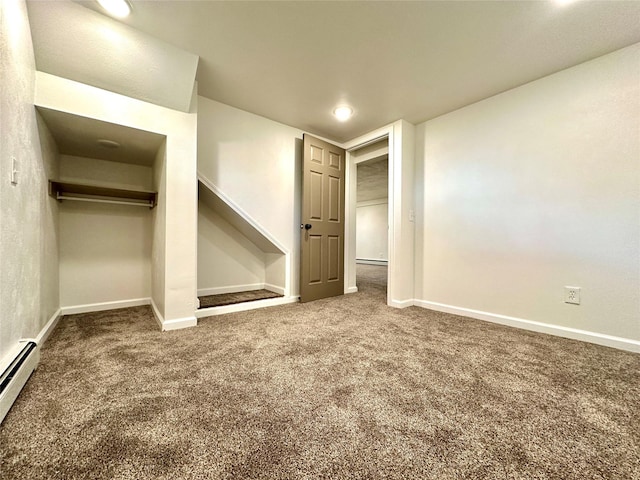 2513 8th Ave N, Great Falls, MT 59401 - unfurnished bedroom with carpet, a baseboard radiator, baseboards, a closet, and a baseboard heating unit