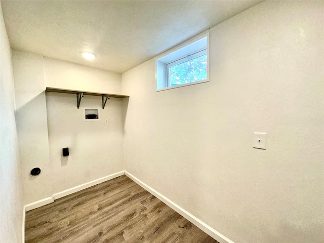 2513 8th Ave N, Great Falls, MT 59401 - washroom with baseboards, wood finished floors, and washer hookup