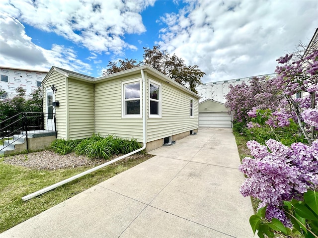 2513 8th Ave N, Great Falls, MT 59401 - view of home's exterior featuring a detached garage and an outbuilding