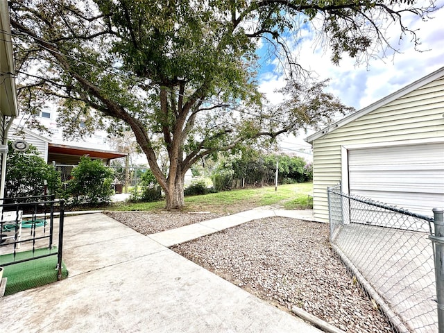 2513 8th Ave N, Great Falls, MT 59401 - view of yard with a garage and a patio area