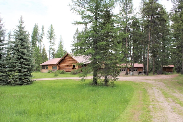 7191 Boy Scout Rd, Seeley Lake, MT 59868 - view of yard with driveway and a garage